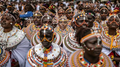Samburu women gather to perform traditional dances in celebration after a race, part of the 32nd Maralal International Camel Derby celebrations, in Kenya. AFP