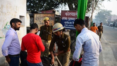 Security personnel people's check the bags on a road in Ayodhya. AFP