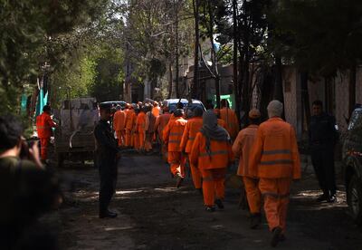 Municipality workers arrive to clear up the site of a Taliban attack on an aid organisation in Kabul on May 9, 2019. AFP