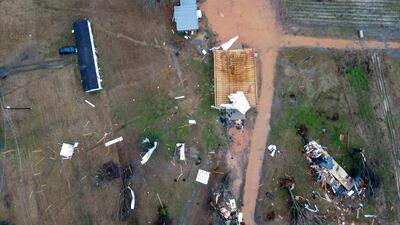 A giant storm system across the South spurred a tornado that shredded the walls of homes and toppled roofs in many towns in Alabama. AP