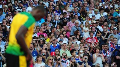 The crowd watches Usain Bolt prepare for his 200m semi-final at London 2012. Pic: Stu Forster/Getty Images