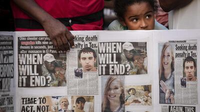 A young girl looks on as she attends a vigil for the victims of the recent mass shootings in El Paso, Texas and Dayton, Ohio, in Grand Army Plaza on August 5, 2019 in the Brooklyn borough of New York City. Getty Images/AFP