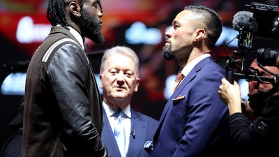 Deontay Wilder, left, and Joseph Parker size each other up. Getty Images