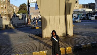 Hamas Hajiri 8, sells tissues to passing drivers at an intersection in downtown Sana'a. Photo: Lindsay Mackenzie for the National.
