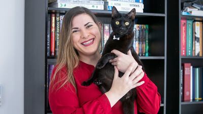 Chef Vanessa Bayma with her cat, Shadow. Ms Bayma says the best money she has spent was Dh7,000 on an injured kitten as she saved a life. Ruel Pableo for The National