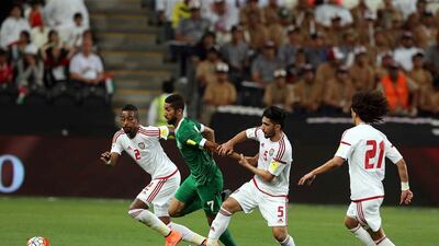 Saudi Arabia's Salman Al Faraj, second left, in action against the UAE in a 2018 World Cup qualifier at Mohammed bin Zayed Stadium in Abu Dhabi, UAE, on March 29, 2016. Satish Kumar / The National