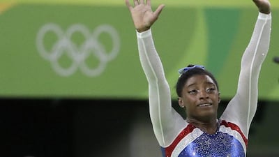 United States' Simone Biles celebrates after winning gold in the gymnastics women's individual all-around competition at the 2016 Rio Olympics. David Goldman / AP Photo / August 11, 2016