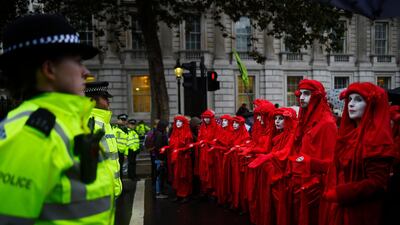 Climate change activists in London block access to various government departments as they start a two week protest. Photo by Peter Summers/Getty Images
