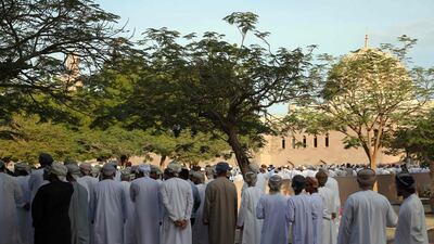 Omanis gather to enter the Sultan Qaboos Mosque to perform funeral prayers. AFP