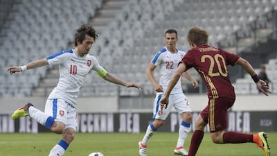 Tomas Rosicky, left, scored the equaliser for the Czech Republic against Russia on Wednesday night. Philipp Guelland / AFP
