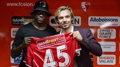 Mario Balotelli of Italy and new FC Sion soccer player, left, poses with Barthelemy Constantin, right, sport director of FC Sion, during a press conference at the Stade de Tourbillon stadium, in Sion, Switzerland, 01 September 2022. EPA / JEAN-CHRISTOPHE BOTT