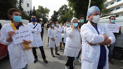 Tunisian nurses take part in a demonstration to demand better working conditions in front of the Ministry of Health in Tunis, Tunisia. EPA