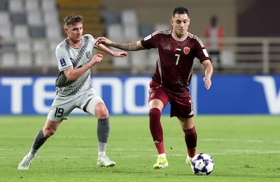 Caio Canedo of Al Wahda battles with Benjamin Bourigeaud of Al Duhail. Chris Whiteoak / The National