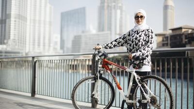 Roudha Alawadhi, who co-created the Instagram group UAE Cycling Girls with a friend, jokes that cycling is a great option for those who are too lazy to jog. Rebecca Rees for The National