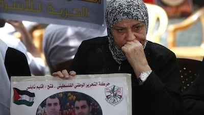 A Palestinian mother whose son is being held in an Israeli prison cries as she takes part in a protest in solidarity with Palestinian prisoners on hunger strike, in the West Bank city of Nablus on May 14, 2017. Alaa Badarneh / EPA