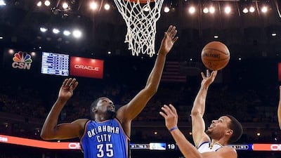 Golden State Warriors guard Stephen Curry, right, in action against former Oklahoma City Thunder forward Kevin Durant during the NBA Western Conference finals. Durant announced on 04 July 2016 that he will join the Golden State Warriors. EPA/JOHN G MABANGLO