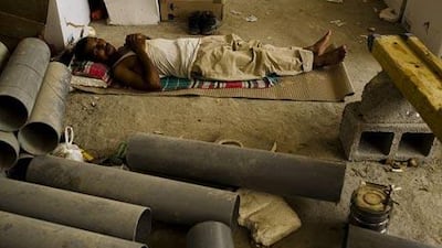 A worker in Abu Dhabi makes the most of his break last July 1, the day it took effect in 2009.