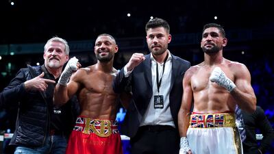 Kell Brook (second left) with Terry Thompson (left), promoter Ben Shalom and Amir Khan after the fight. PA