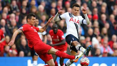 Dele Alli of Tottenham and Dejan Lovren of Liverpool compete for the ball. Alex Livesey / Getty Images