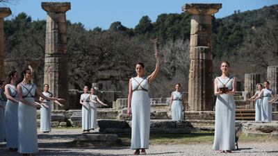 Greek actress Xanthi Georgiou, playing the role of High Priestess, lights the flame during the Olympic flame lighting ceremony. Reuters