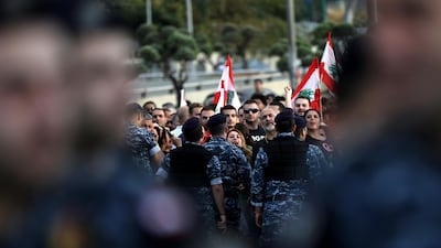 Members of the security forces gather as backers of the Free Patriotic Movement founded by the Lebanese president stage a rally in his support on a road leading to the presidential palace in Baabda near the capital Beirut. AFP