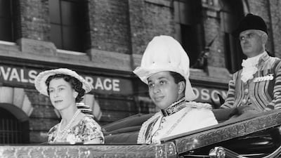 King Faisal II of Iraq and the queen leave Victoria Station in London for Buckingham Palace, in July 1956. Getty
