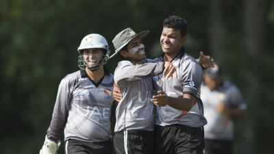 Khurram Khan, centre, is confident his bowlers can cause trouble for Hong Kong’s rusty middle-order batsmen on Thursday. Chris Young / The National