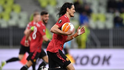 Edinson Cavani picks up the ball after scoring the equaliser for Manchester United during the Europa League final. EPA
