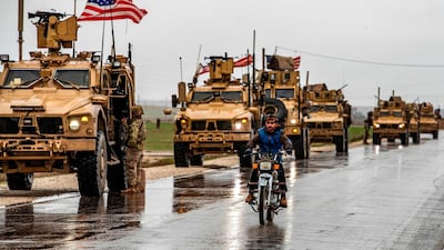 American soldiers patrol on the M4 highway in the town of Tal Tamr in the northeastern Syrian Hasakeh province on the border with Turkey on January 24, 2020. / AFP / Delil SOULEIMAN