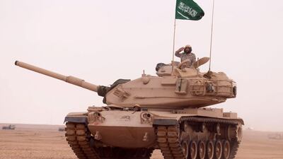 A soldier salutes atop a Saudi tank during a multi-national military exercise at an undisclosed location in Saudi Arabia on March 2, 2016. Saudi Press Agency/Handout/EPA