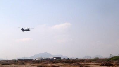 A helicopter evacuates wounded people after Sheikh bin Farid palace, used as a base by the Saudi-led coalition forces, was attacked. Saleh Al Obeidi / AFP