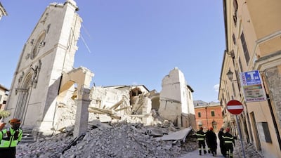 Monks walk in front of the St Benedict Cathedral in Norcia, central Italy on October 31, 2016, a day after the third powerful earthquake to hit Italy in two months destroyed the 14-century building and other historic landmarks. Gregorio Borgia / AP Photo