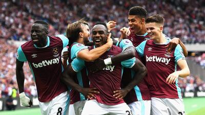 Michail Antonio, centre, celebrates with teammates after scoring West Ham's winning goal against Bournemouth. Michael Regan / Getty Images