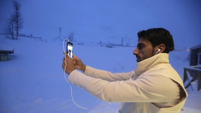 A refugee takes a selfie at the front of his camp at a hotel touted as the world’s most northerly ski resort in Riksgransen, Sweden. Ints Kalnins / Reuters