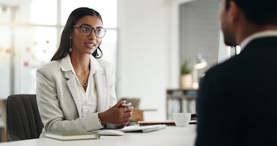 Interview invitations should make clear what options are available, such as sufficient time to answer, the opportunity to supplement an answer in writing, or alternatives to phone-only screening where spontaneous speech is not essential to the role. Getty Images