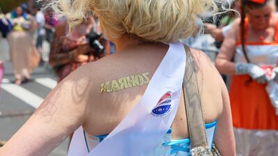 This Mr Mamdani supporter pinned his name on her back during the 43rd annual Mermaid Parade at Coney Island. AFP