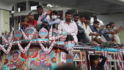 People ride a bus in Karachi, Pakistan. EPA