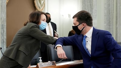 US senator Maria Cantwell and Pete Buttigieg greet each other at a Senate hearing to review the nomination of Mr Buttigieg as Secretary of Transport in Washington on January 21, 2021. Reuters