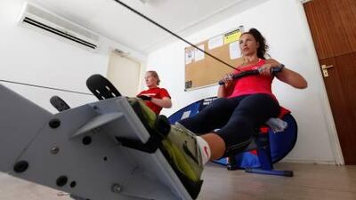 Debbie Beadle, left, and Katie Pattison-Hart during their 24-hour marathon at the Mina Seyahi rowing club.