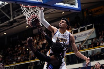 Victor Wembanyama, top, dunks during a game with Metropolitans 92 in June. AP