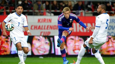 Japan’s Keisuke Honda, centre, is a big star from the region and his profile has grown since a move to AC Milan. Yomiuri Shimbun / AP Photos