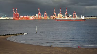An aerial picture shows crude oil tanker Minerva Eleftheria passing the docks in Liverpool. ADCB expects Opec+ "to remain flexible", adjusting production up or down as per the requirements of evolving global demand. AFP