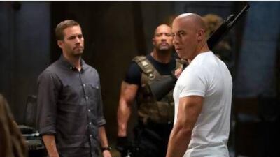 From left: Paul Walker, Dwayne The Rock Johnson and Vin Diesel in a scene from Fast And Furious 6. Courtesy Universal