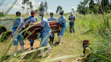 A Red Cross team carry the coffin of a woman suspected of having died from Ebola during an outbreak in the Democratic Republic of the Congo. AFP