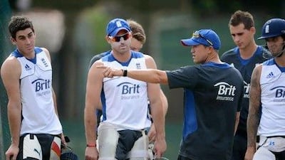 The head coach Andy Flower speaks with the England batsmen, who had a poor game against India, in Colombo today. Gareth Copley / Getty Images