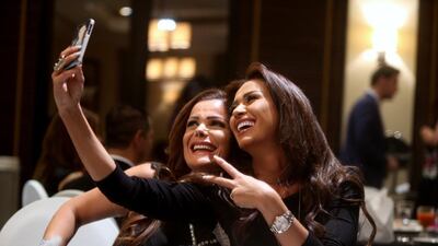 Nadeen Al Rasi (holding the camera), an actress on the show, takes selfies during Suhoor at Hawksbill Restaurant at the Saadiyat Beach Golf Club.