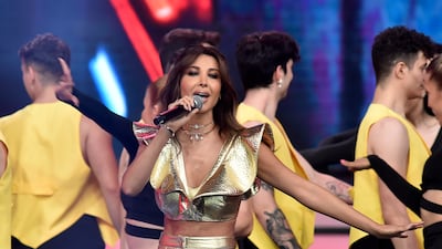 Lebanese singer Nancy Ajram performs 'Sah Sah' on stage during a Miss Lebanon 2022 contest, held at Forum De Beirut in Beirut. EPA
