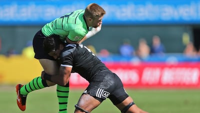 Scotland's Kyle Steyn, left, is tackled by Masirewa in a quarterfinal match. AP Photo