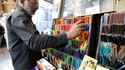 Ali al-Mandalawi arranges colored pencils in his artist supply shop at the al-Saray market in central Baghdad, Iraq, 08 October 2022. Al-Mandalawi owns more than a million pencils and ballpoint pens of various sizes and uses in his store, where he began amassing products in 1985 as both hobby and passion. The store became a destination for calligraphers, painters and tourists in the historic Saray market in Baghdad. EPA / AHMED JALIL