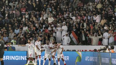 UAE players celebrate Khalfan Mubarak's opening goal.